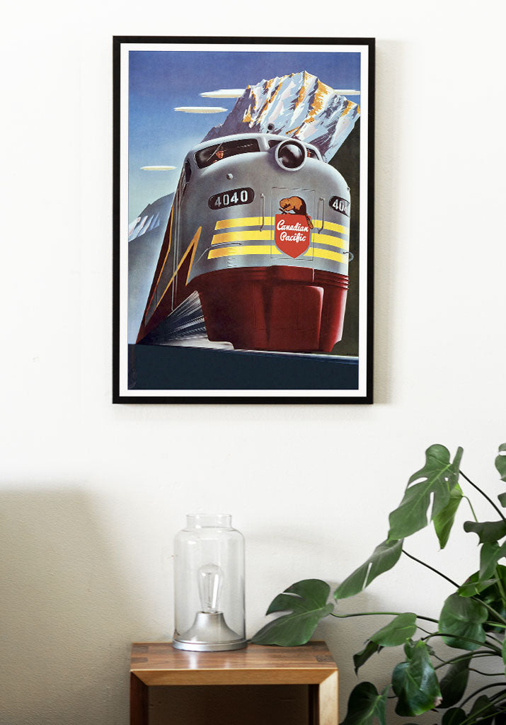 Canada travel poster, showing a train in a winter landscape with snowy hills in the background