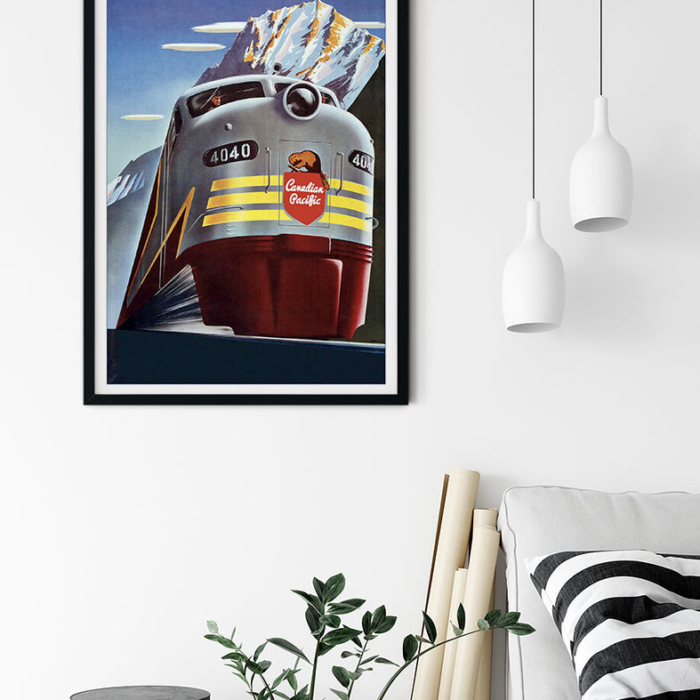 Canada travel poster, showing a train in a winter landscape with snowy hills in the background